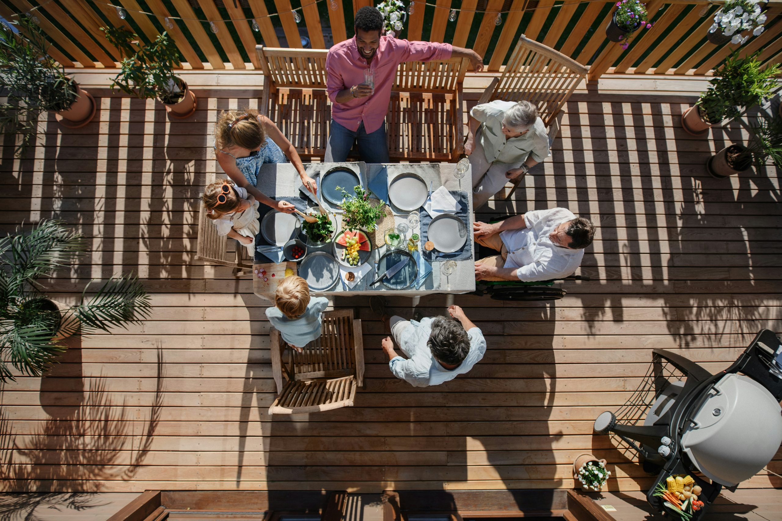family enjoying a wood deck